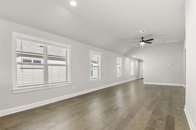 unfurnished living room with ceiling fan, dark hardwood / wood-style floors, and vaulted ceiling