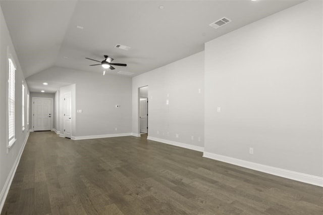 unfurnished room featuring dark hardwood / wood-style floors, ceiling fan, and vaulted ceiling