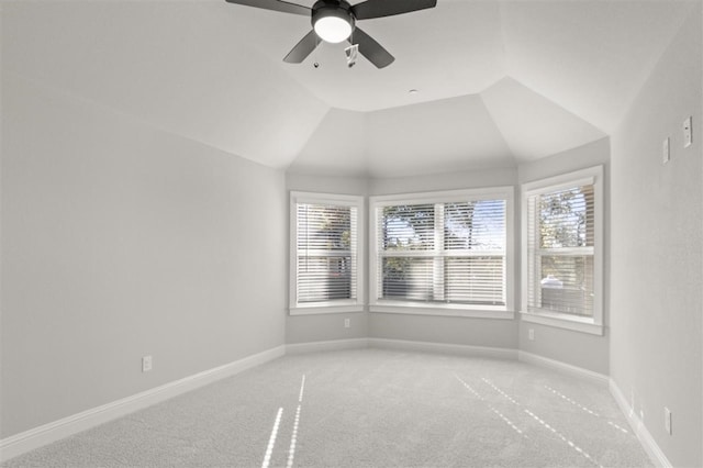 carpeted empty room with ceiling fan and lofted ceiling