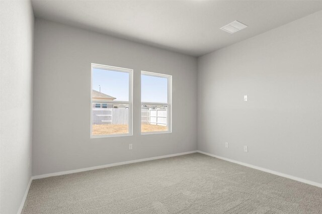 224 Barley Ln, Elgin, TX 78621 - spare room with baseboards, carpet flooring, and visible vents