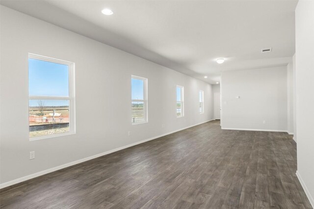 224 Barley Ln, Elgin, TX 78621 - unfurnished room with dark wood-style flooring, visible vents, baseboards, and recessed lighting