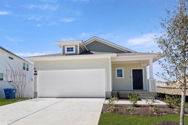 224 Barley Ln, Elgin, TX 78621 - view of front facade with a shingled roof, a garage, and concrete driveway