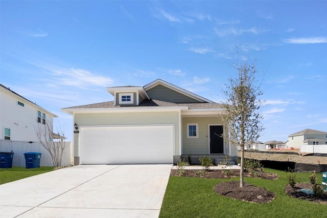 224 Barley Ln, Elgin, TX 78621 - view of front of home featuring driveway, a garage, a front lawn, and fence