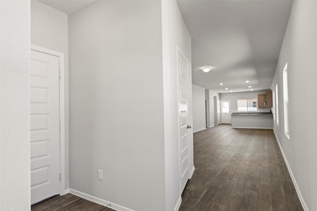 224 Barley Ln, Elgin, TX 78621 - hallway with baseboards and dark wood-type flooring