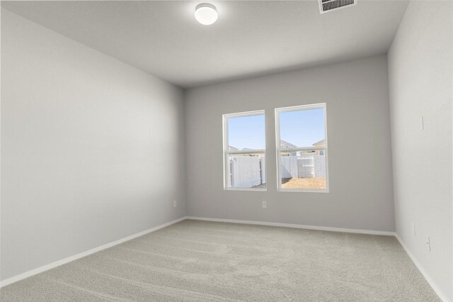 224 Barley Ln, Elgin, TX 78621 - unfurnished room featuring light carpet, baseboards, and visible vents
