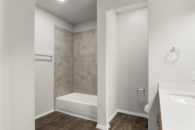 224 Barley Ln, Elgin, TX 78621 - bathroom featuring baseboards, wood finished floors, toilet, and vanity