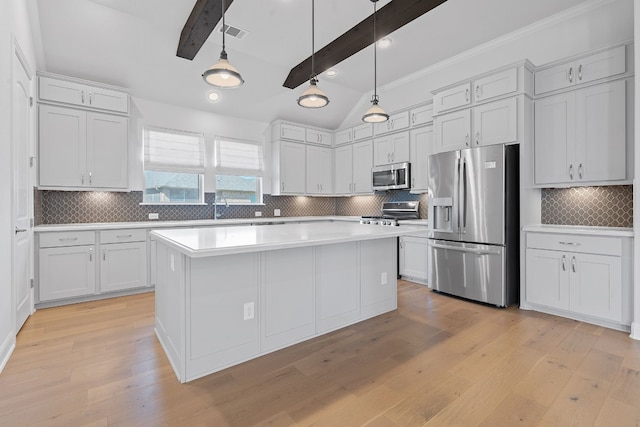 kitchen featuring decorative backsplash, beamed ceiling, light wood-type flooring, and appliances with stainless steel finishes