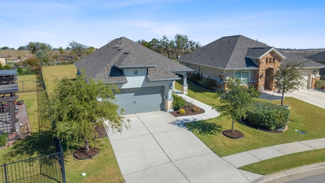 view of front of home with a front yard and a garage