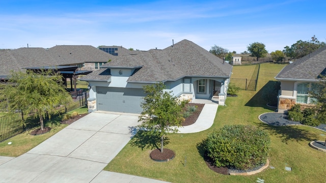 view of front of house featuring a front yard and a garage