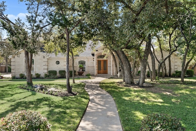 view of front of property featuring french doors and a front yard