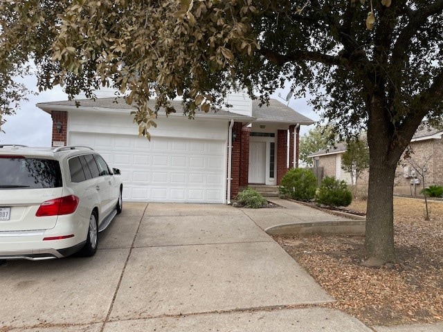 ranch-style house featuring a garage