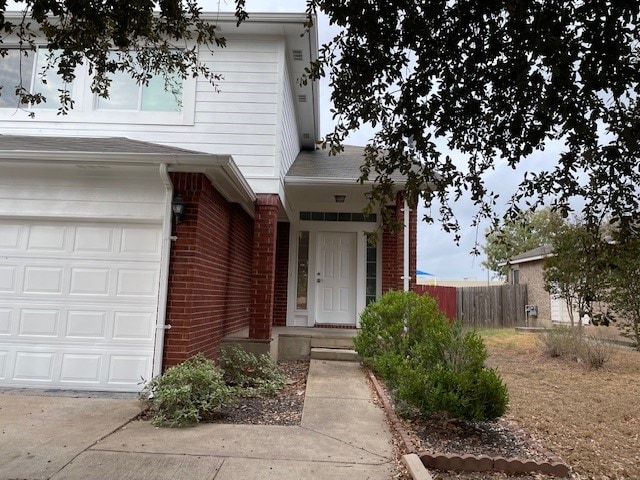 view of exterior entry featuring a garage