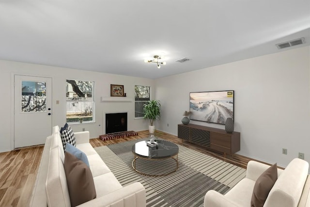 living room with light hardwood / wood-style floors