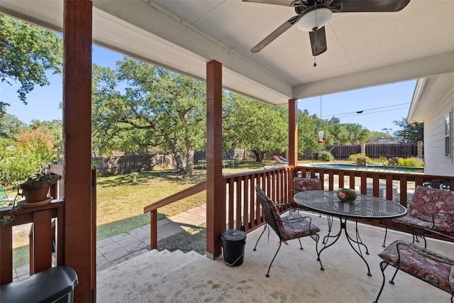 exterior space featuring a yard, ceiling fan, and a patio area