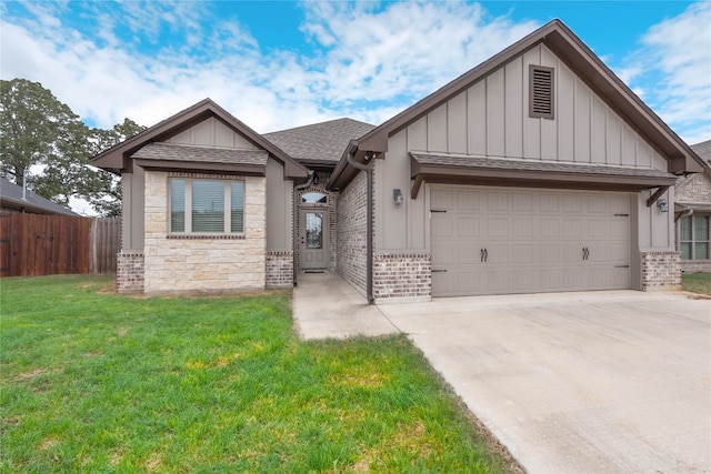 view of front of property with a front yard and a garage