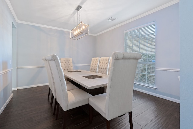 dining area featuring ornamental molding, dark hardwood / wood-style floors, and a notable chandelier