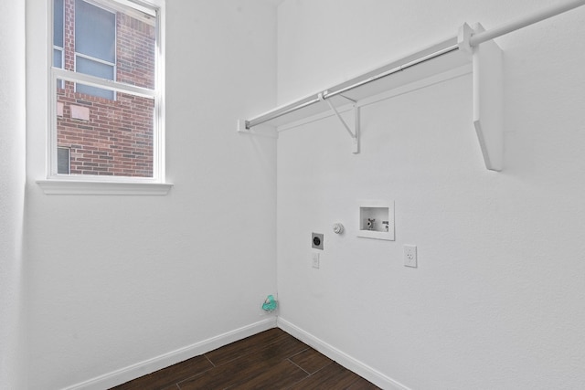 clothes washing area with dark wood-type flooring, washer hookup, hookup for an electric dryer, and gas dryer hookup