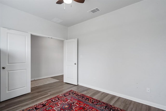 unfurnished bedroom with hardwood / wood-style flooring and ceiling fan