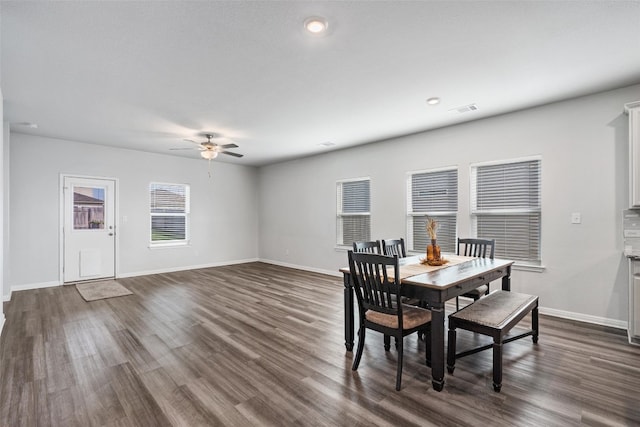 dining area featuring ceiling fan and dark hardwood / wood-style flooring