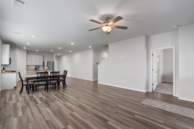 dining room featuring ceiling fan and light hardwood / wood-style flooring