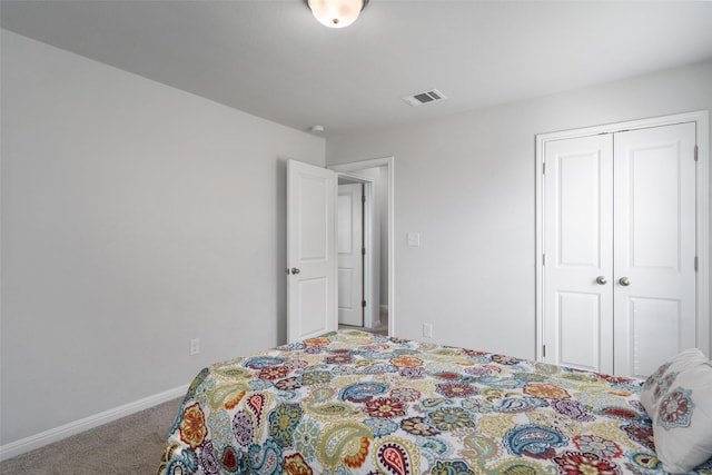 carpeted bedroom featuring a closet