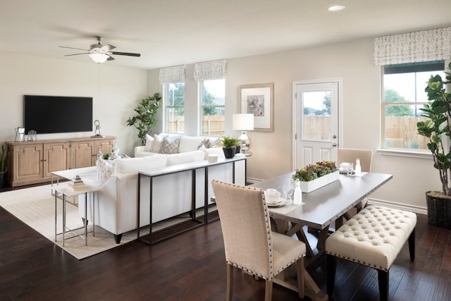 dining space featuring dark hardwood / wood-style floors and ceiling fan