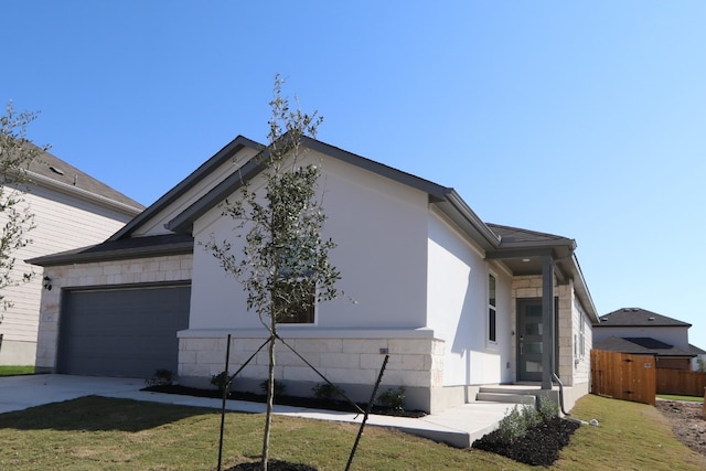 view of property exterior featuring a yard and a garage