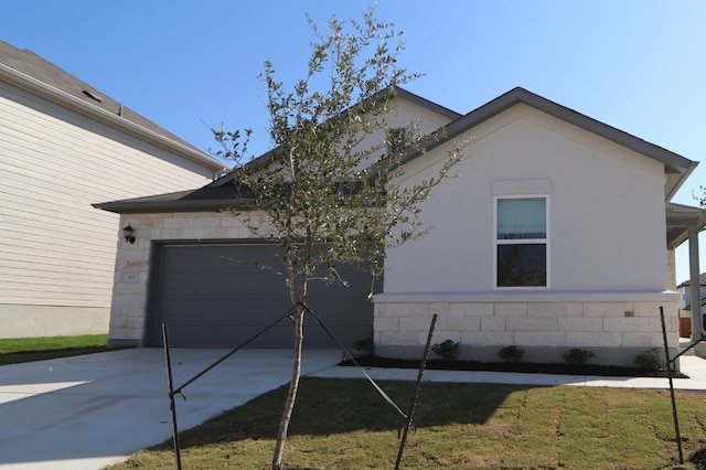 view of property exterior featuring a yard and a garage