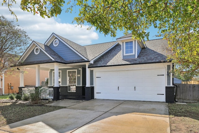 craftsman-style house featuring a porch and a garage