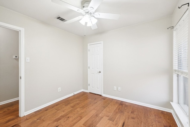 unfurnished bedroom featuring hardwood / wood-style flooring and ceiling fan