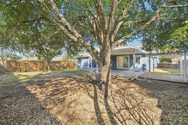 back of property featuring a patio