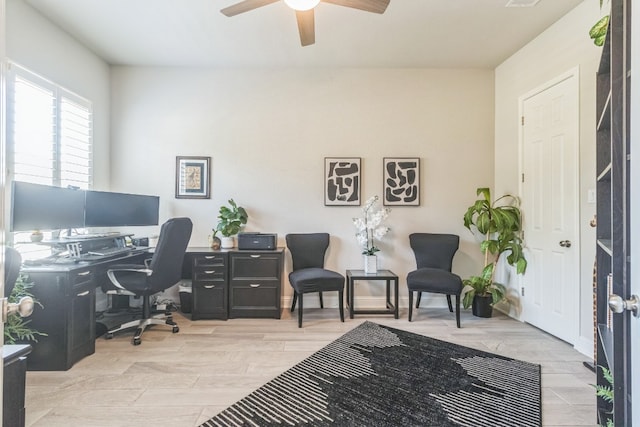 home office featuring ceiling fan and light hardwood / wood-style flooring