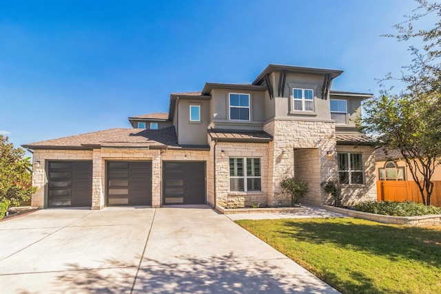 prairie-style home with a front yard