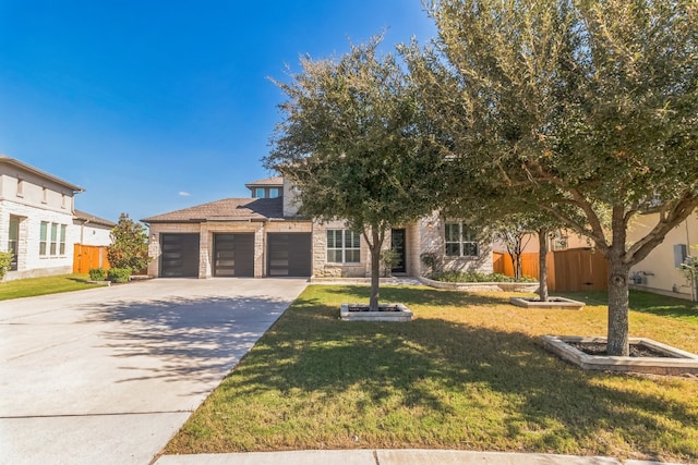 view of front facade with a garage and a front yard