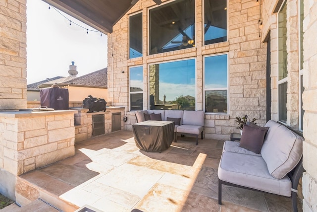 view of patio featuring area for grilling and a grill