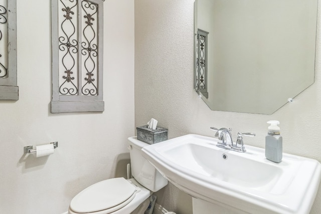 bathroom with sink and toilet