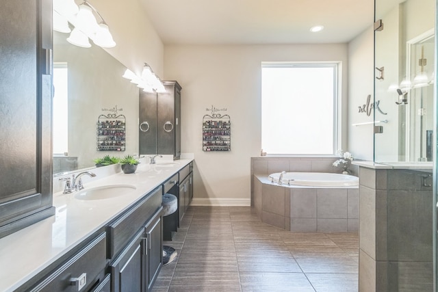 bathroom featuring tile patterned flooring, vanity, and independent shower and bath