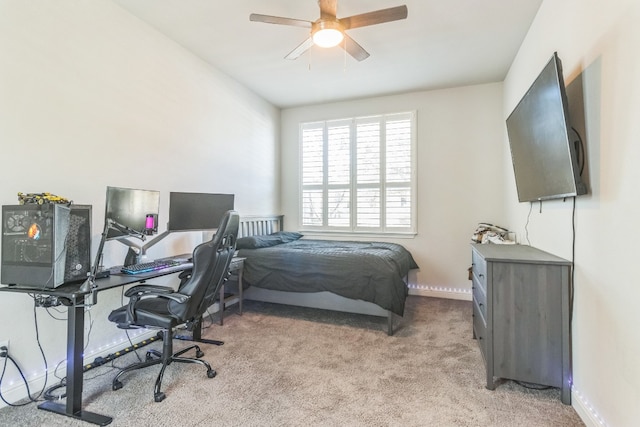 bedroom featuring ceiling fan and light carpet