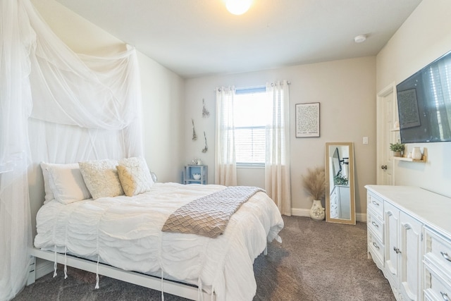 bedroom featuring dark carpet