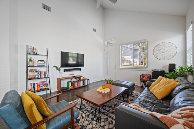 living room with hardwood / wood-style floors, high vaulted ceiling, a wealth of natural light, and ceiling fan