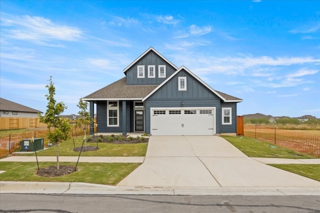 view of front of home featuring central AC, a garage, and a front lawn