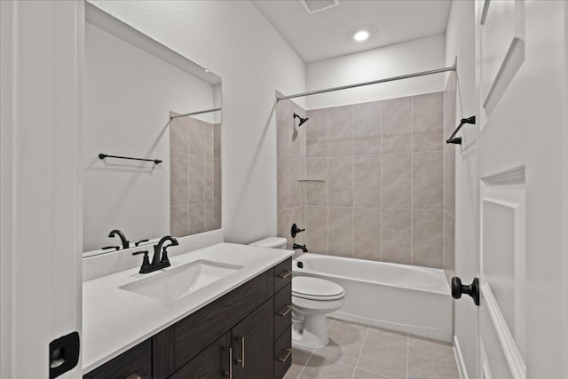 full bathroom with toilet, vanity, tile patterned floors, and tiled shower / bath