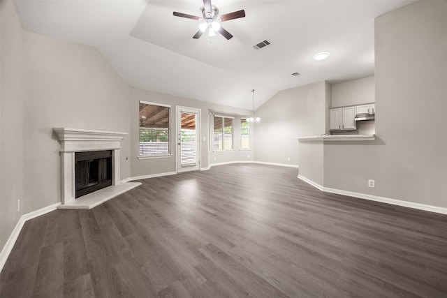 unfurnished living room with ceiling fan, dark wood-type flooring, and vaulted ceiling