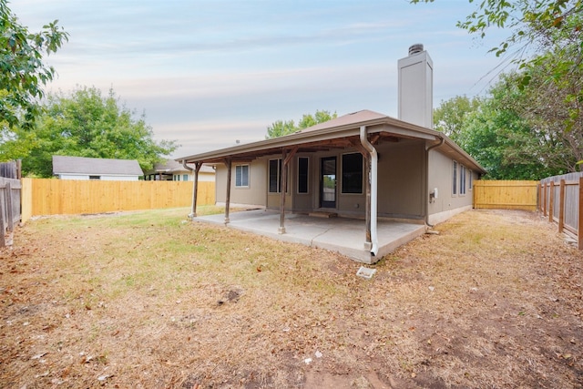 rear view of property with a patio area