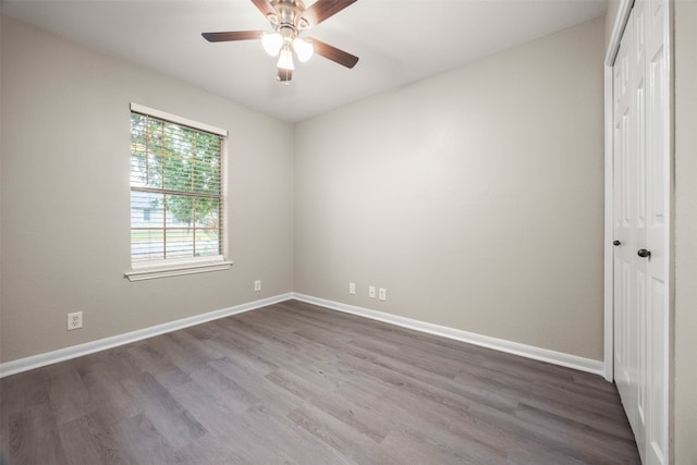 spare room featuring ceiling fan and wood-type flooring