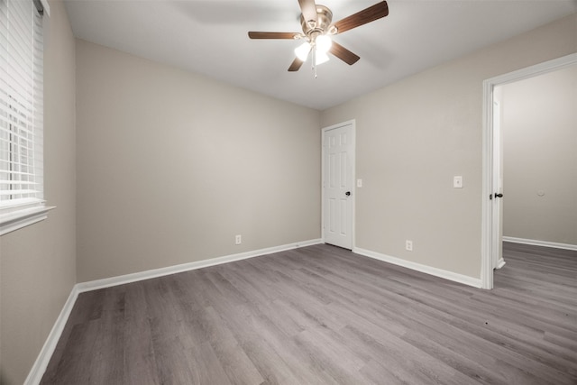 unfurnished room featuring ceiling fan and light hardwood / wood-style flooring