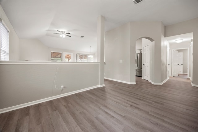 interior space with ceiling fan, hardwood / wood-style floors, and vaulted ceiling