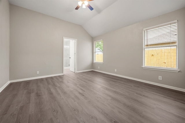 unfurnished room with dark hardwood / wood-style floors, ceiling fan, and vaulted ceiling