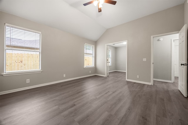 interior space with ceiling fan, dark wood-type flooring, and vaulted ceiling