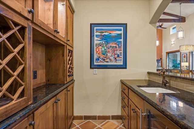 interior space with light tile patterned floors and sink